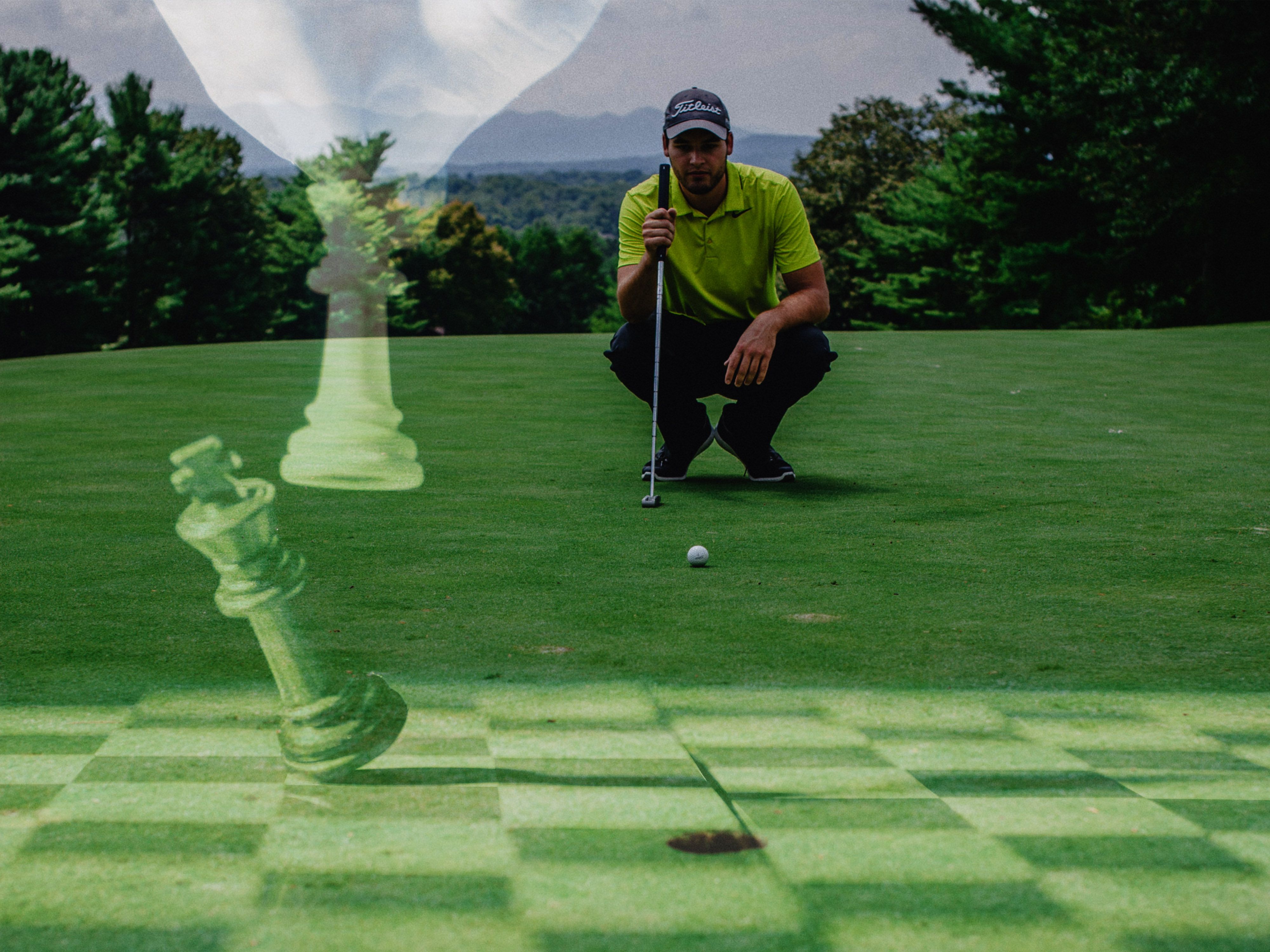 Golfer lining up and to make a putt and concentrating with a chess board overlaid