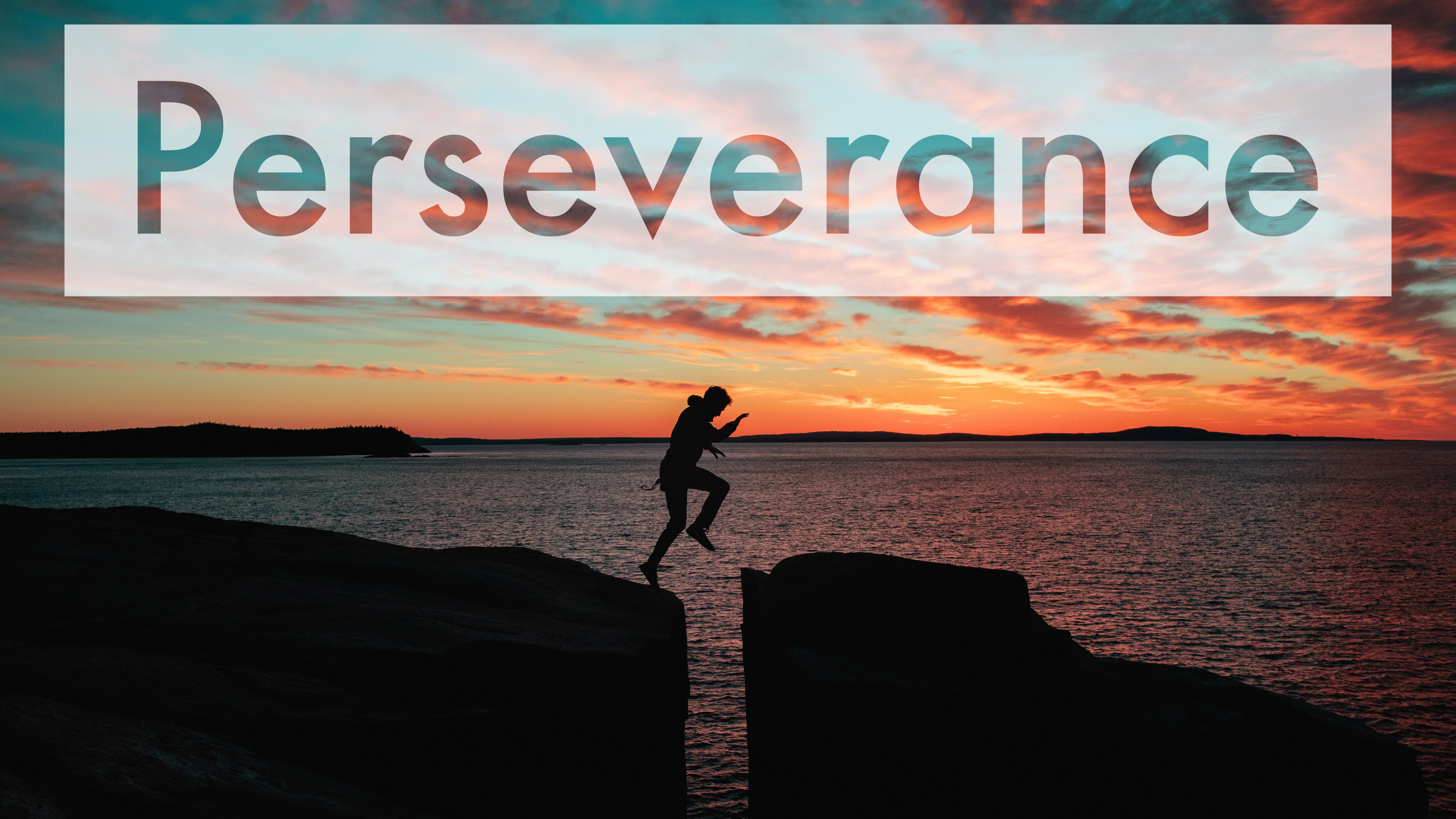 Man silhouette is jumping over crevice of a rock mountain during sunset. The words 'Peseverance' are over the image