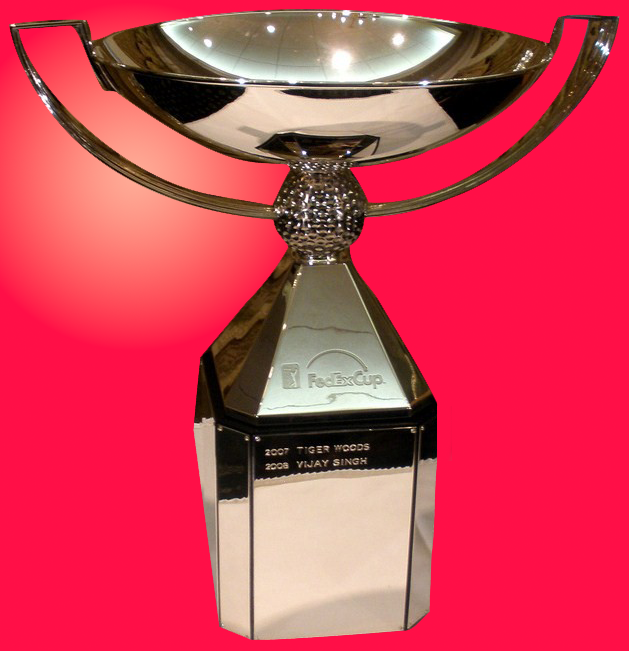 The silver FedEx Cup trophy with a cubical base that extends to a bowl at the top. The trophy is placed over a red background